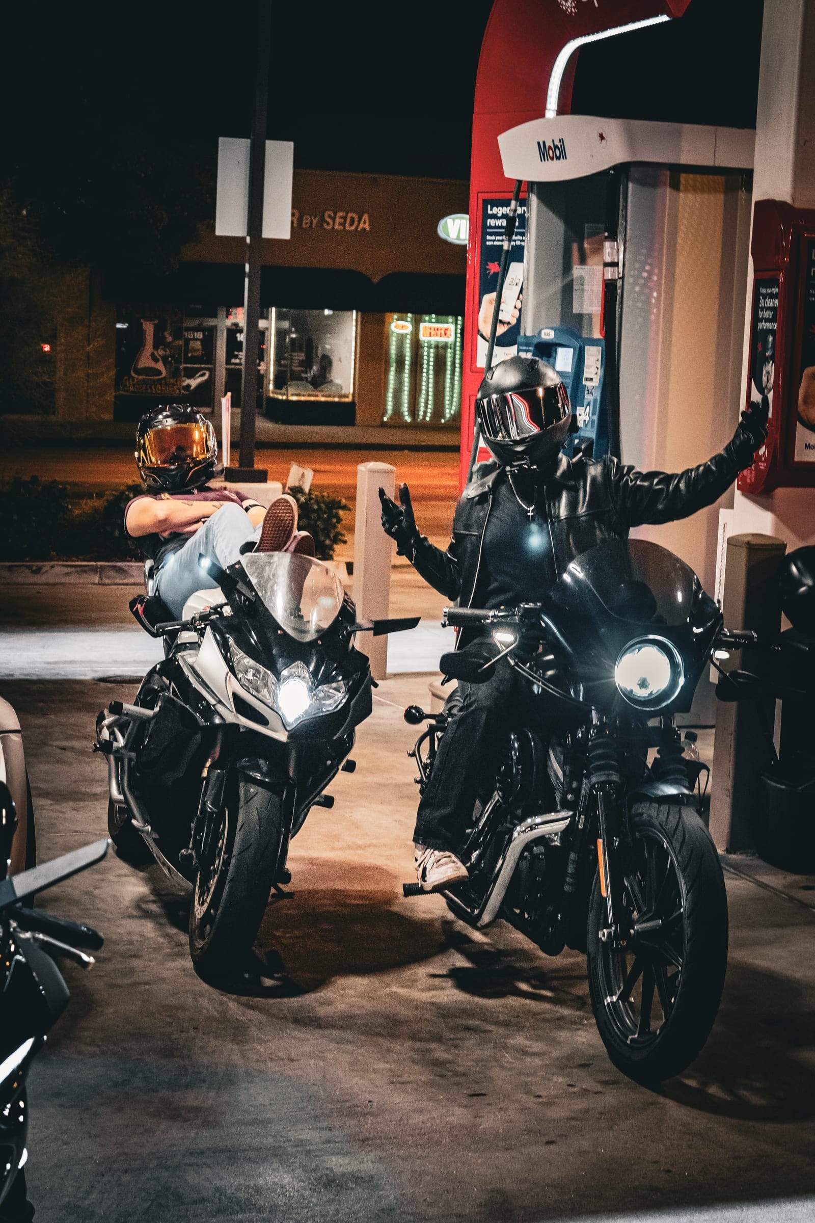 Riders on their bikes between the pumps