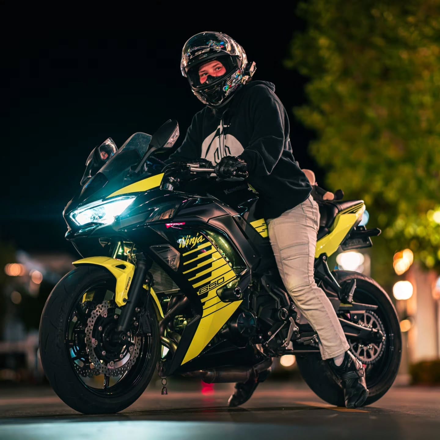 Rider on a yellow sportbike at night